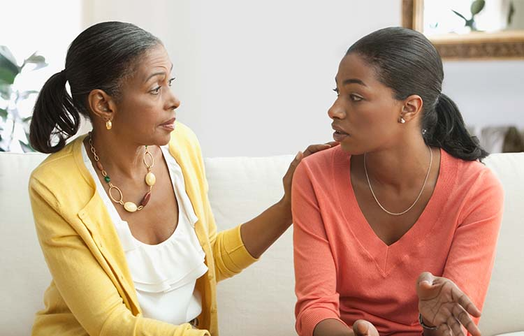 Adult daughter talking to her mother about her financial legacy.